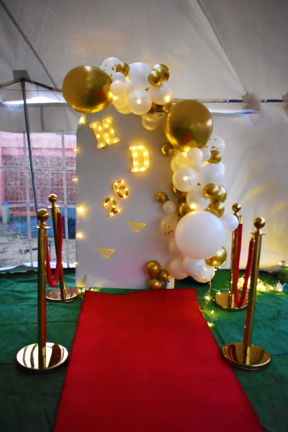 Decor aisle setup with backdrop and balloons