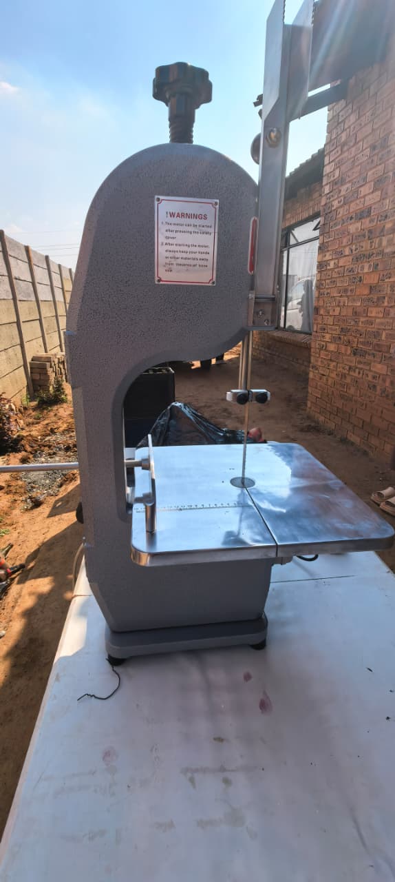 Vertical close-up of meat cutter controls and body